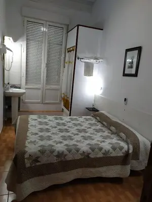 Cama o camas de una habitación en Hostal Miami