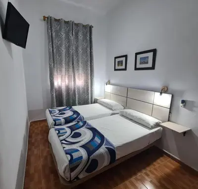 Cama o camas de una habitación en Hostal Miami