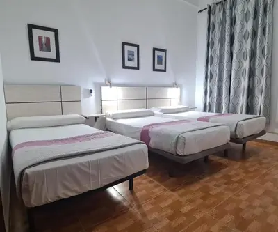 Cama o camas de una habitación en Hostal Miami