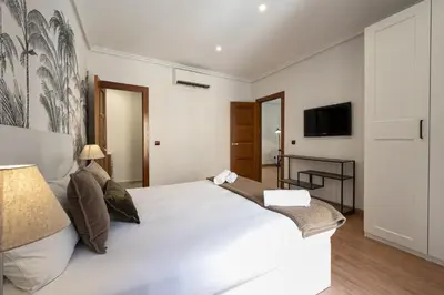 Cama o camas de una habitación en Madrid Centric Suites