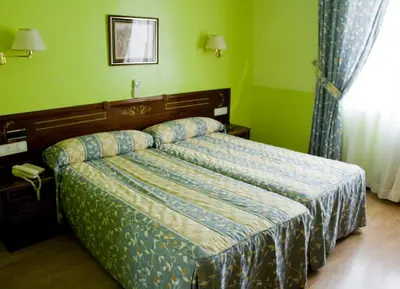 Cama o camas de una habitación en Hostal Centro Sol Madrid