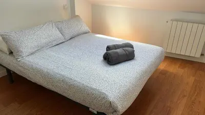 Cama o camas de una habitación en Onefam Madrid