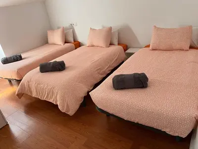 Cama o camas de una habitación en Onefam Madrid