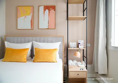 Cama o camas de una habitación en Numa Madrid Script
