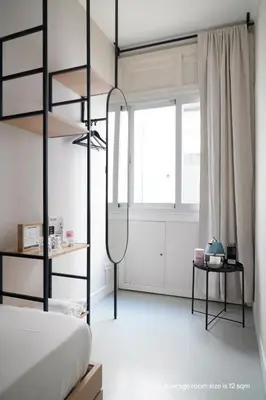 Cama o camas de una habitación en Numa Madrid Script