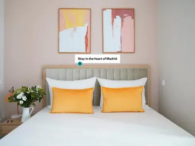 Cama o camas de una habitación en Numa Madrid Script