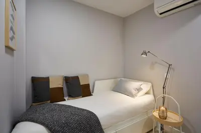 Cama o camas de una habitación en LEEWAYS APARTMENT in AVE MARÍA