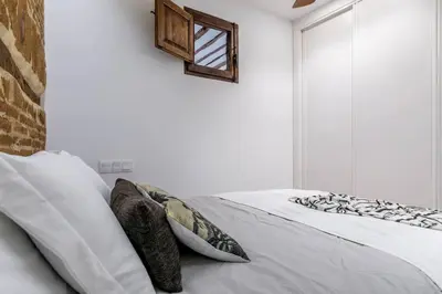 Cama o camas de una habitación en Bonito apartamento en típica corrala en el centro de Madrid