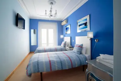 Cama o camas de una habitación en Hostal Adriano