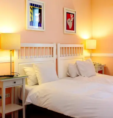 Cama o camas de una habitación en Hostal Adriano