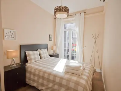 Cama o camas de una habitación en Acogedor callao! 2hab/wifi/ac