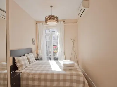 Cama o camas de una habitación en Acogedor callao! 2hab/wifi/ac