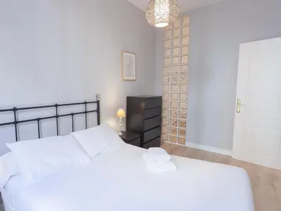 Cama o camas de una habitación en Enorme y acogedor piso en la puerta del sol