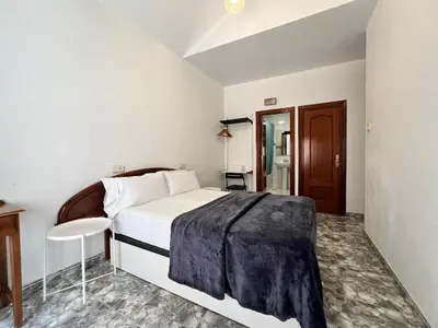 Cama o camas de una habitación en Hostal Palacios Fuencarral