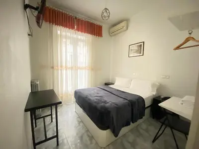 Cama o camas de una habitación en Hostal Palacios Fuencarral