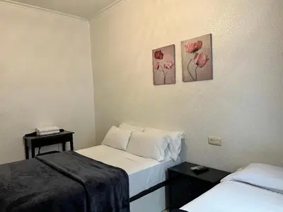 Cama o camas de una habitación en Hostal Palacios Fuencarral