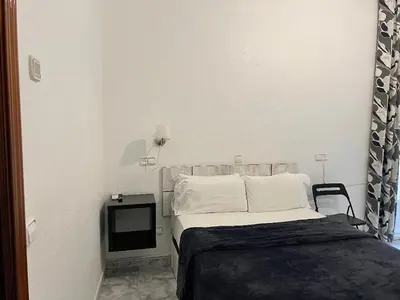 Cama o camas de una habitación en Hostal Palacios Fuencarral