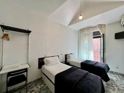 Cama o camas de una habitación en Hostal Palacios Fuencarral