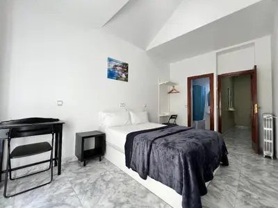 Cama o camas de una habitación en Hostal Palacios Fuencarral