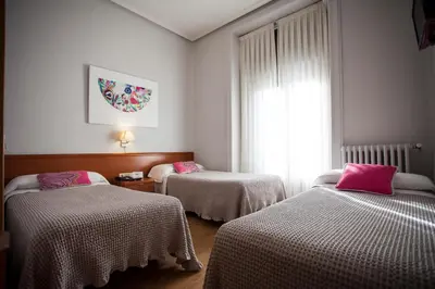Cama o camas de una habitación en Hostal Santa Cruz