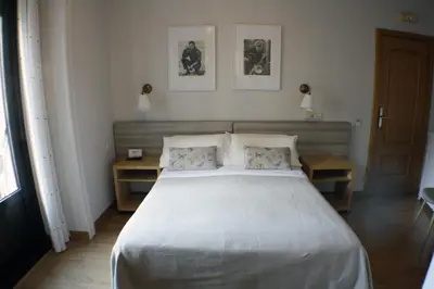 Cama o camas de una habitación en Hostal Santa Cruz