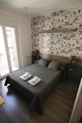 Cama o camas de una habitación en Hostal MH Fuencarral