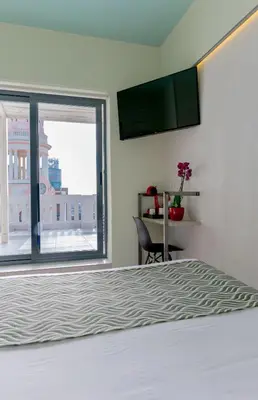 Cama o camas de una habitación en Hostal Charlotte-Gran Vía