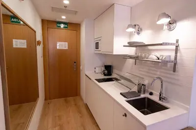 Una cocina o zona de cocina en Plaza Mayor Suites & Apartments