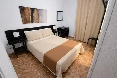 Cama o camas de una habitación en Hostal Prada