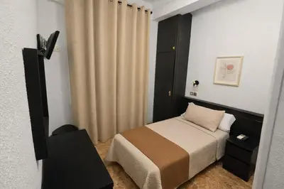 Cama o camas de una habitación en Hostal Prada