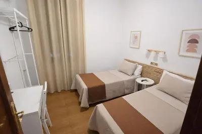 Cama o camas de una habitación en Hostal Prada