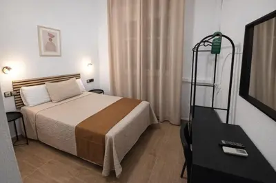Cama o camas de una habitación en Hostal Prada