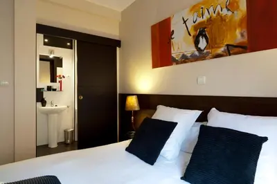Cama o camas de una habitación en THC Tirso Molina Hostel
