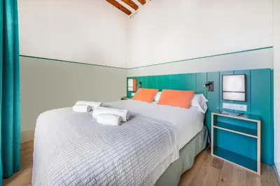 Cama o camas de una habitación en Slow Suites Chueca