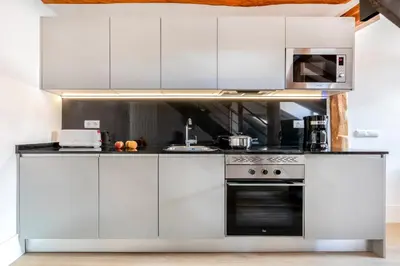 Una cocina o zona de cocina en Slow Suites Chueca
