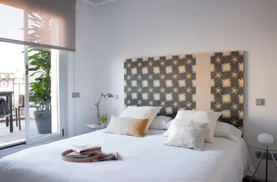Cama o camas de una habitación en Eric Vökel Boutique Apartments - Madrid Suites