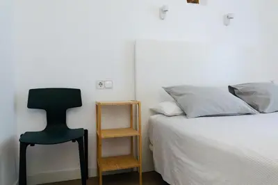 Cama o camas de una habitación en Hostal La Zona