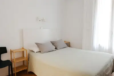 Cama o camas de una habitación en Hostal La Zona