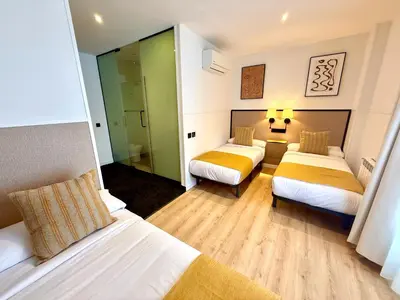 Cama o camas de una habitación en Mucho Madrid