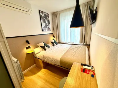 Cama o camas de una habitación en Mucho Madrid