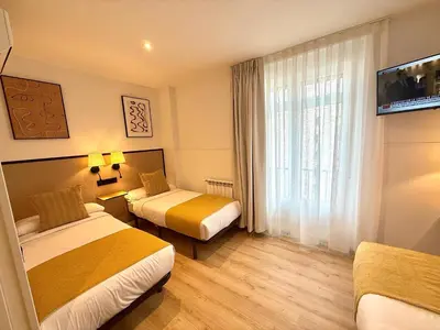 Cama o camas de una habitación en Mucho Madrid