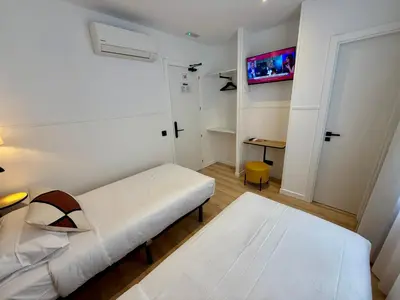 Cama o camas de una habitación en Mucho Madrid