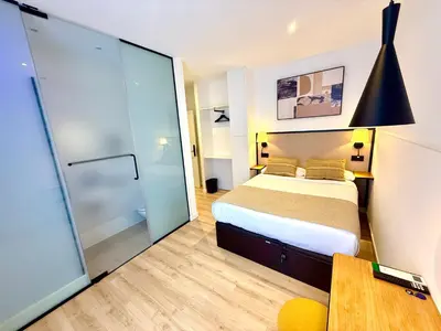 Cama o camas de una habitación en Mucho Madrid