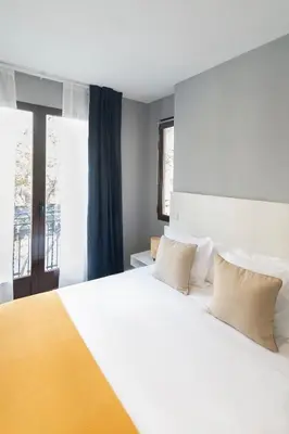Cama o camas de una habitación en 8Rooms Madrid