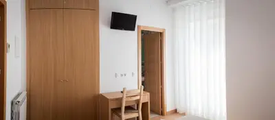 Una televisión o centro de entretenimiento en Hostal San Antonio