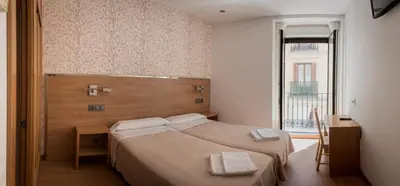 Cama o camas de una habitación en Hostal San Antonio