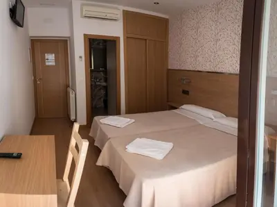 Cama o camas de una habitación en Hostal San Antonio
