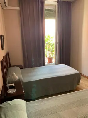 Cama o camas de una habitación en Hostal Río Paraná