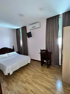 Cama o camas de una habitación en Hostal Río Paraná