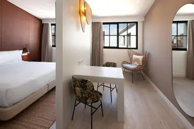 Cama o camas de una habitación en Atocha Hotel Madrid, Tapestry Collection by Hilton